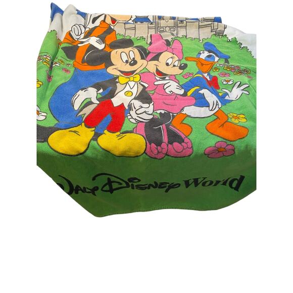 Beach towels it is a big and it a Disney towel has several characters on it - Picture 3 of 4